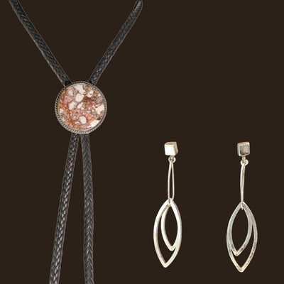 Wild Horse Bolo Tie and Leaf Earrings Set in Sterling Silver, shown on an espresso background