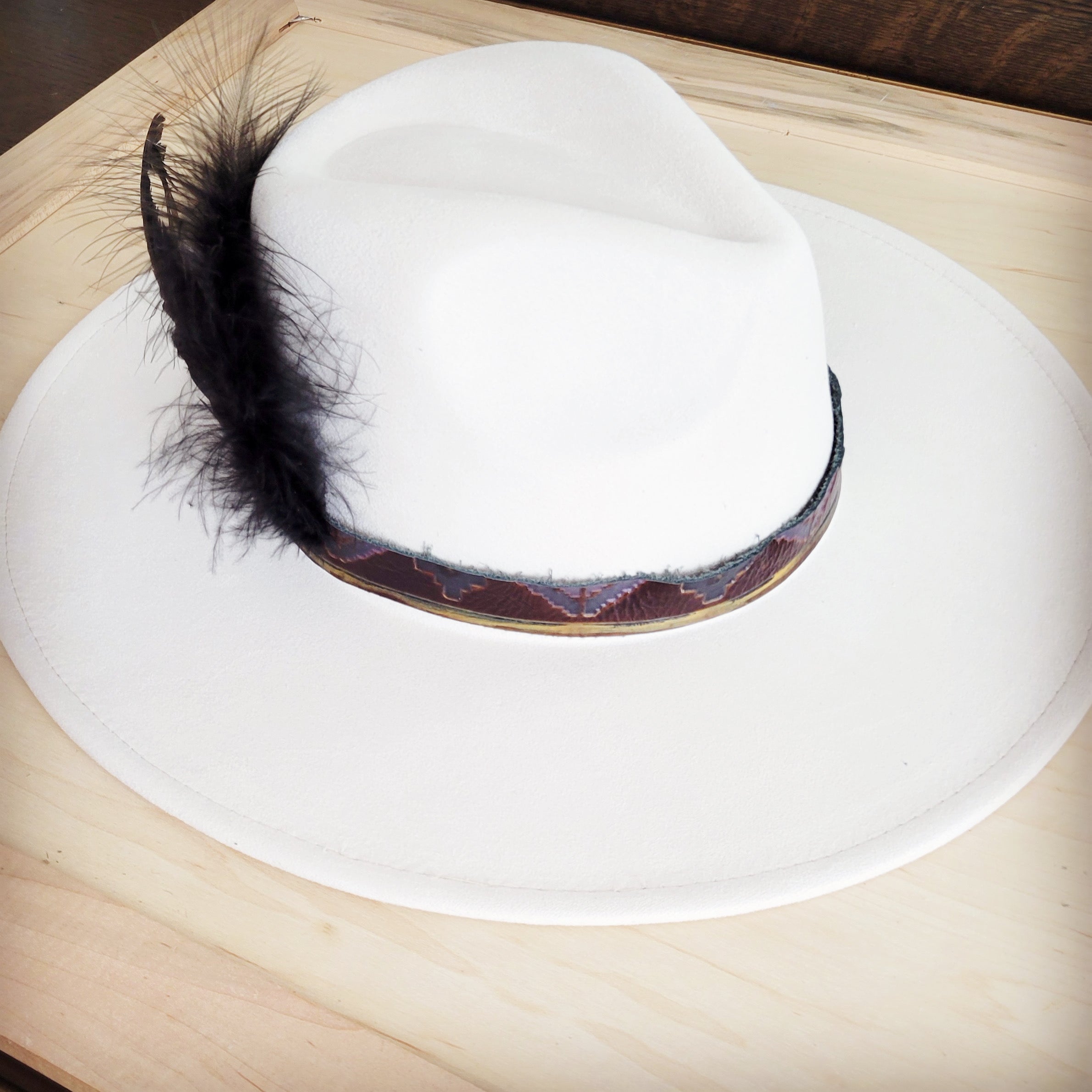 Magenta Navajo leather hat band with black feathers