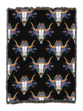 Steer skull cotton throw in the Black colorway, repeating longhorn skulls in white and tan with purple and orange feather accents on a black ground