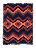 Sunset Desert cotton throw blanket in a high contrast flame stitch zigzag of coral and salmon against deep navy and brick red
