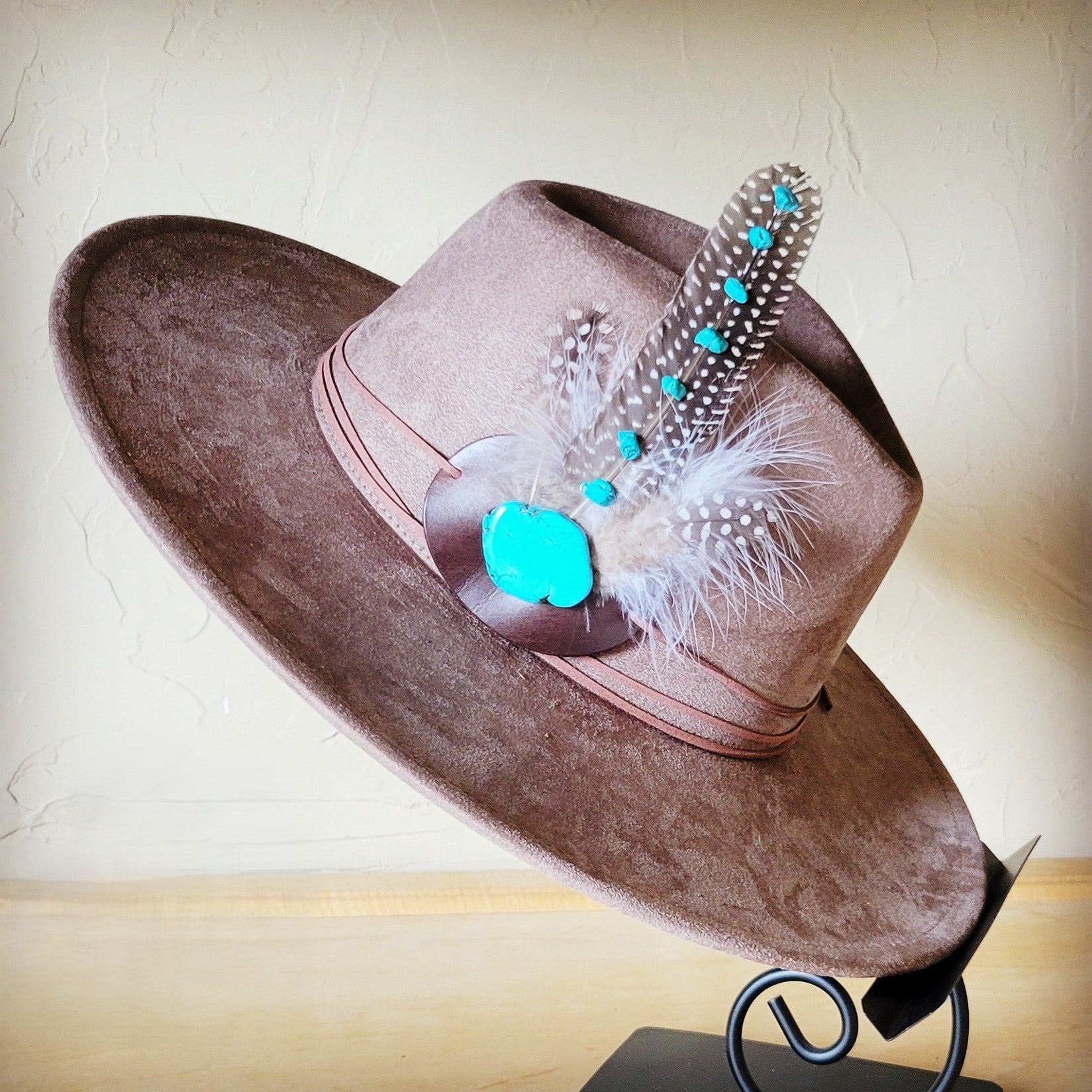 Taupe boho western hat with a feather hat band