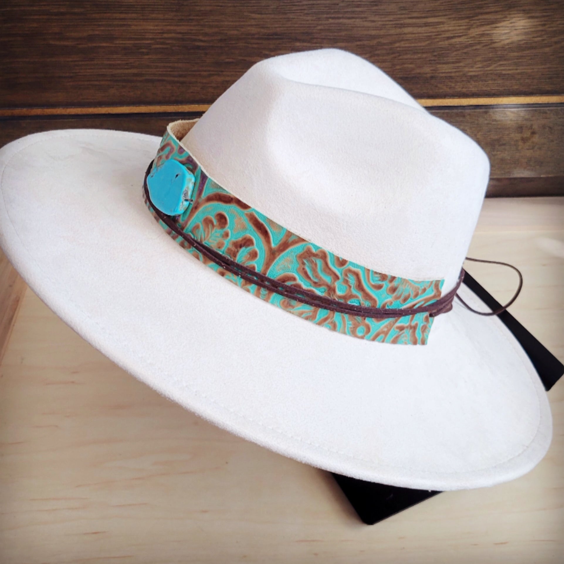 Turquoise and brown floral tooled leather hat band with a slab, additional view