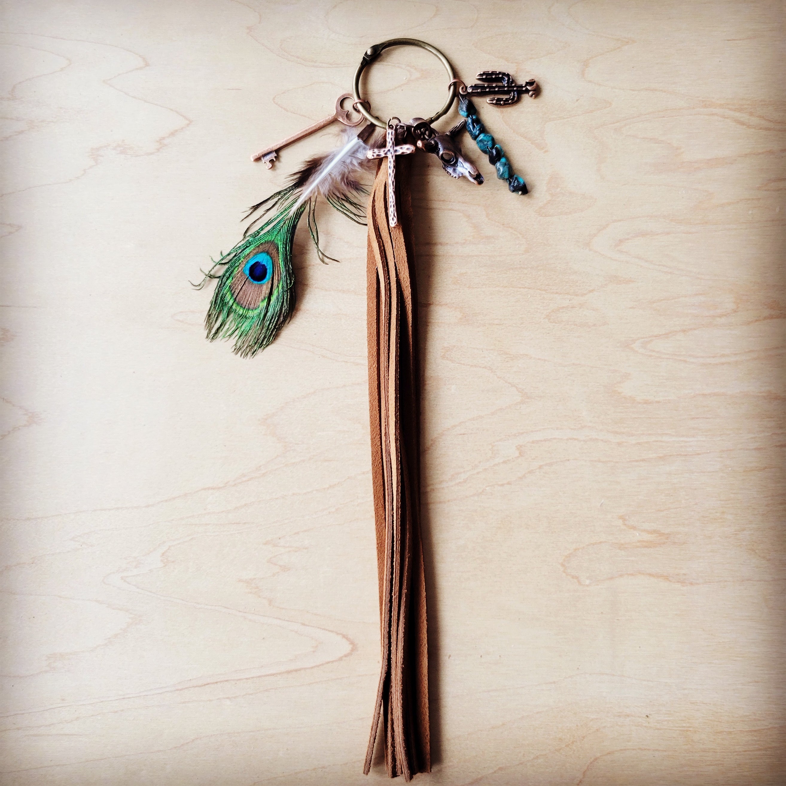 Leather boot charm with peacock feathers and turquoise