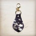 Brown hair-on-hide leather key chain with silver metallic spotting and gold hardware