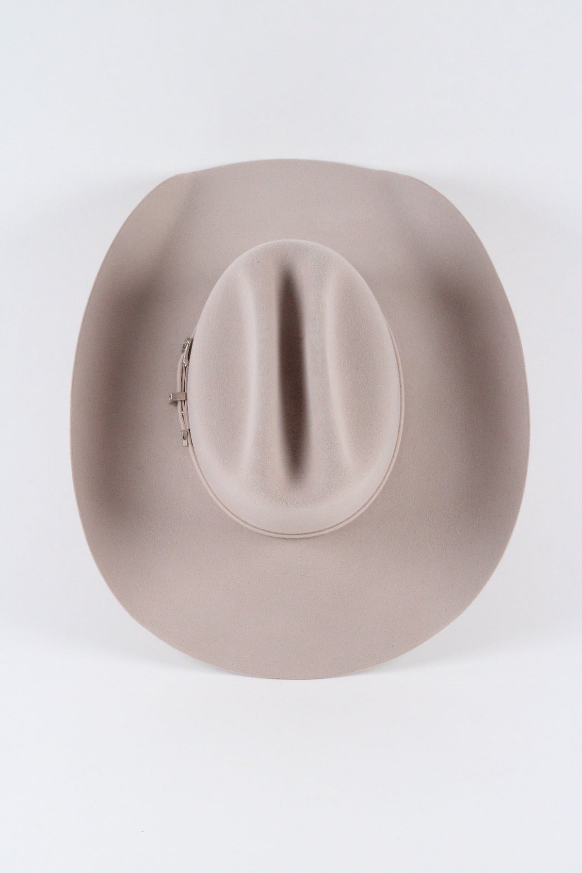 Top view of the desert sand Wren cowboy hat showing the creased cattleman crown and silver-tone buckle