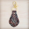 Turquoise and brown floral tooled leather key chain with gold hardware