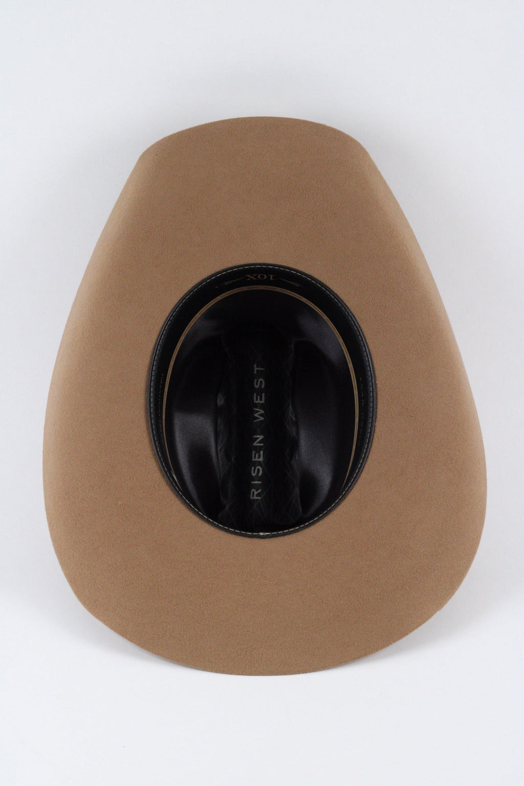 Underside of the camel Wren cowboy hat showing the brim, sweatband and satin lining