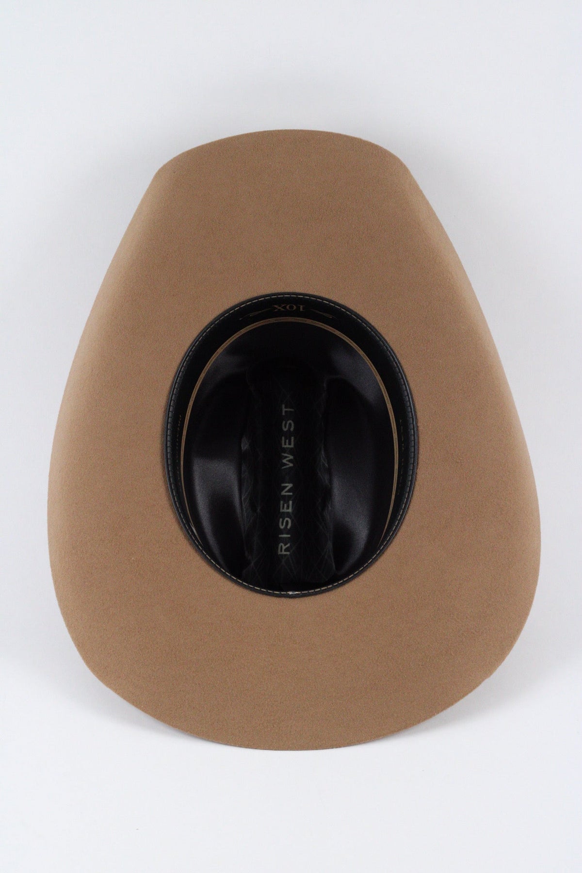 Underside of the camel Wren cowboy hat showing the brim, sweatband and satin lining