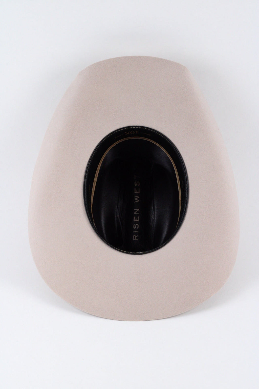 Underside of the desert sand Wren cowboy hat showing the brim, sweatband and satin lining
