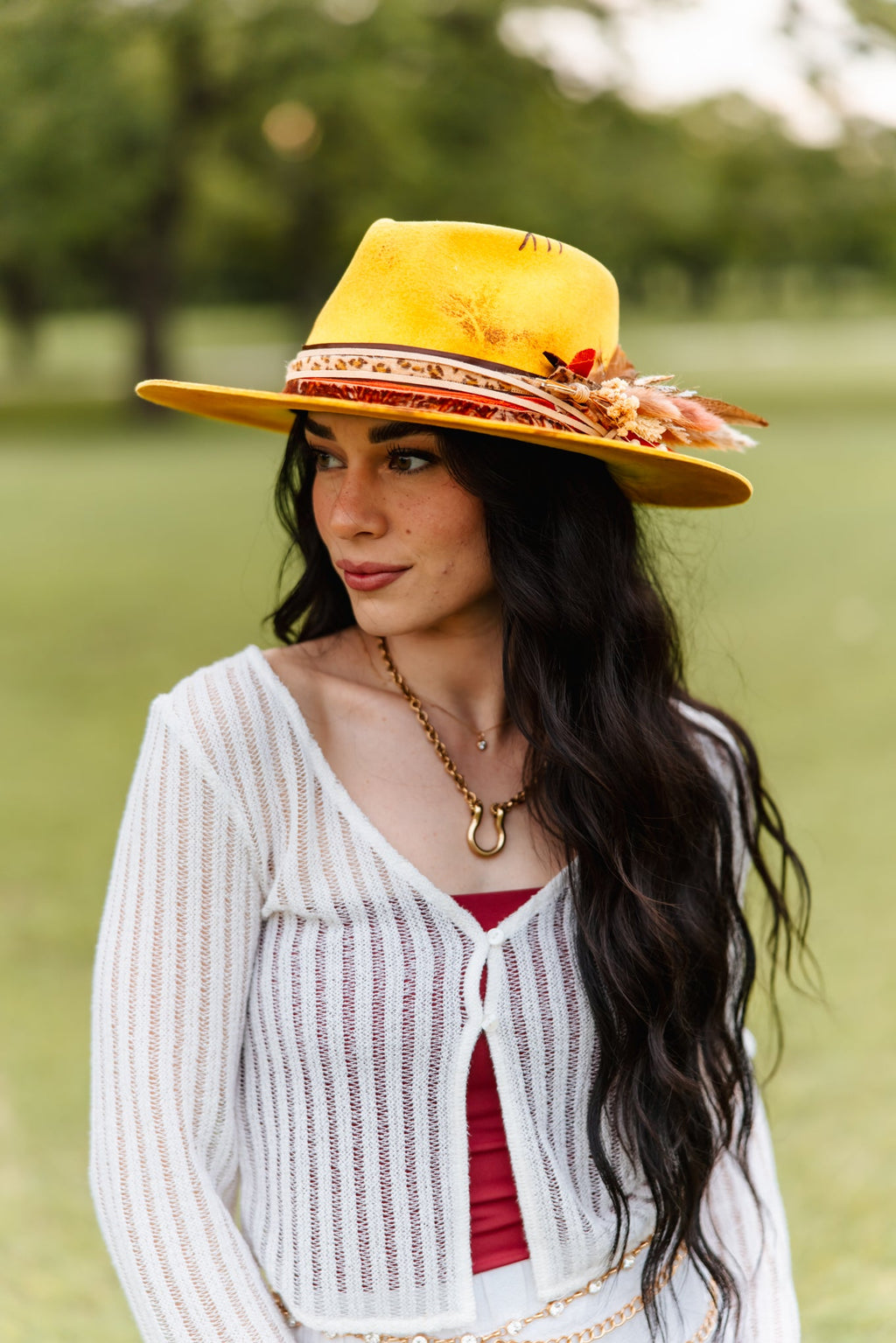 Close view of the dried florals on the yellow wool rancher hat