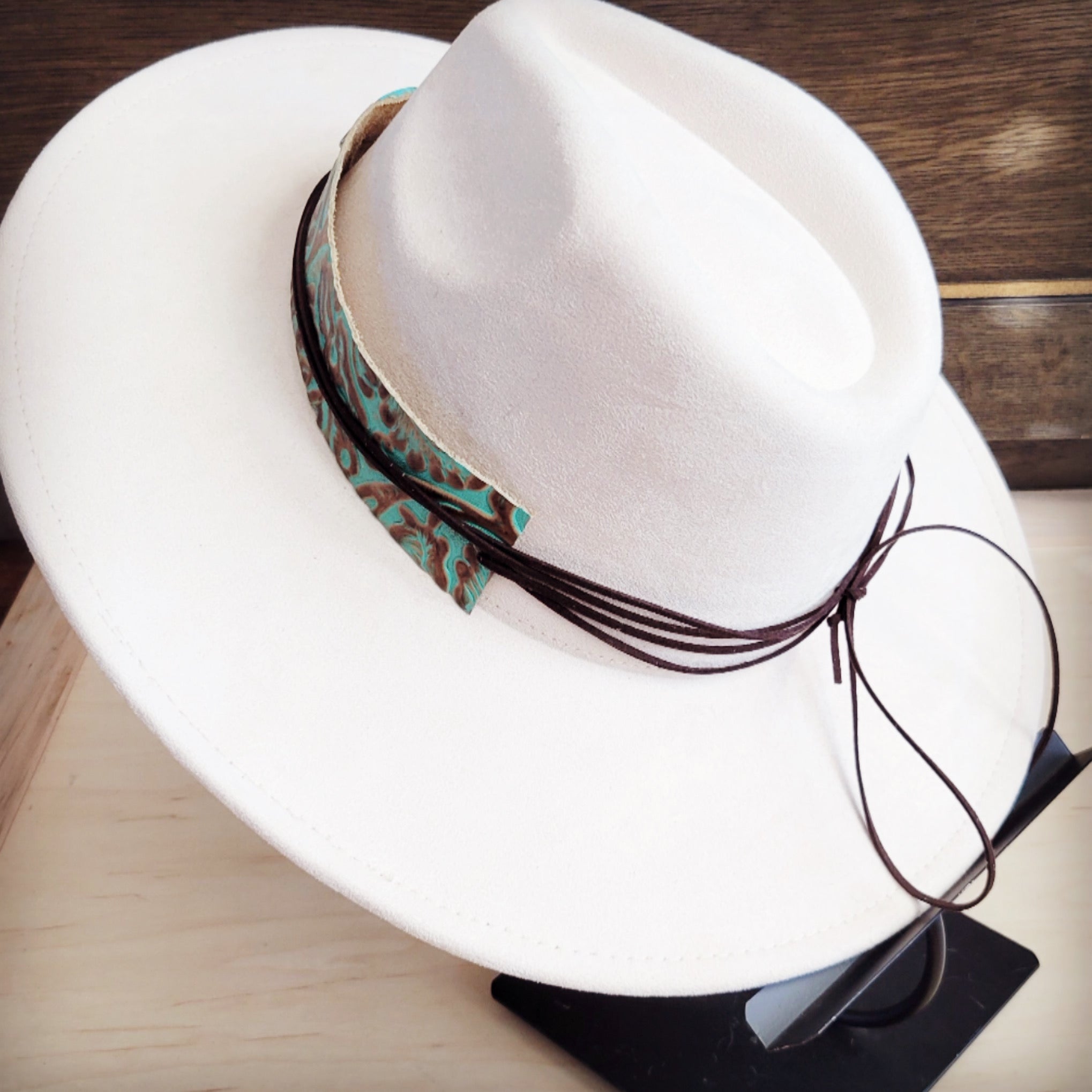 Turquoise and brown floral tooled leather hat band with a slab, additional view