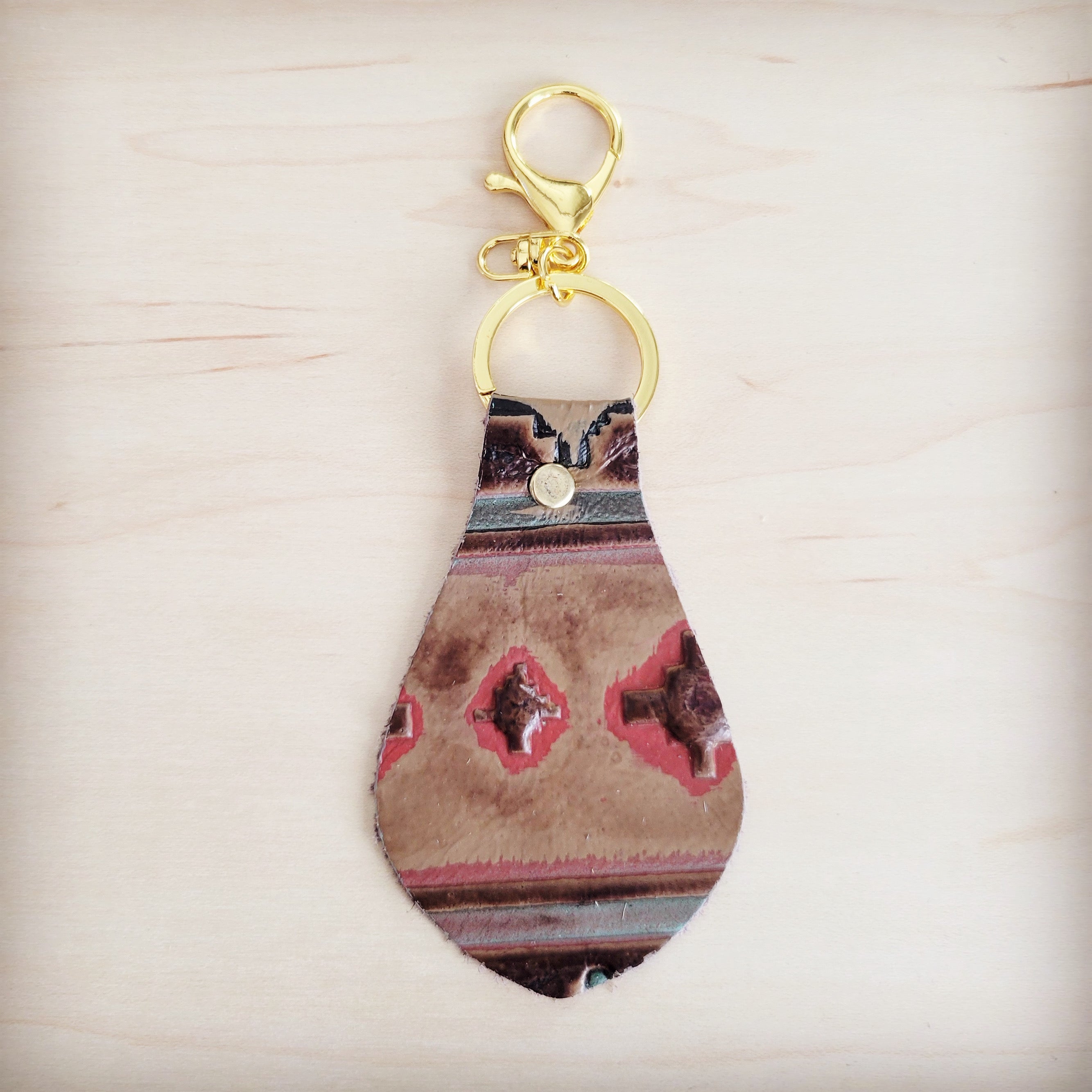 Red and tan southwest print hair-on-hide leather key chain with gold hardware