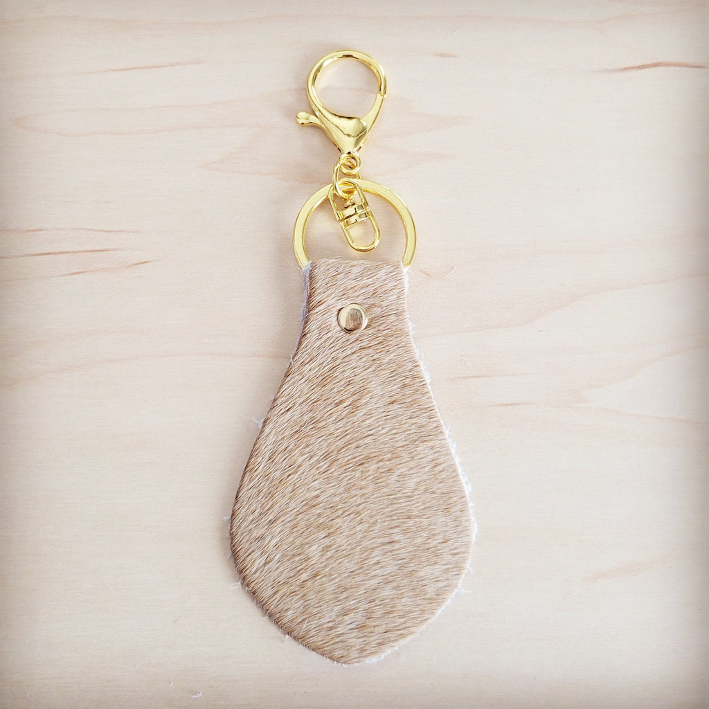 Close view of the light tan hair on the leather key chain