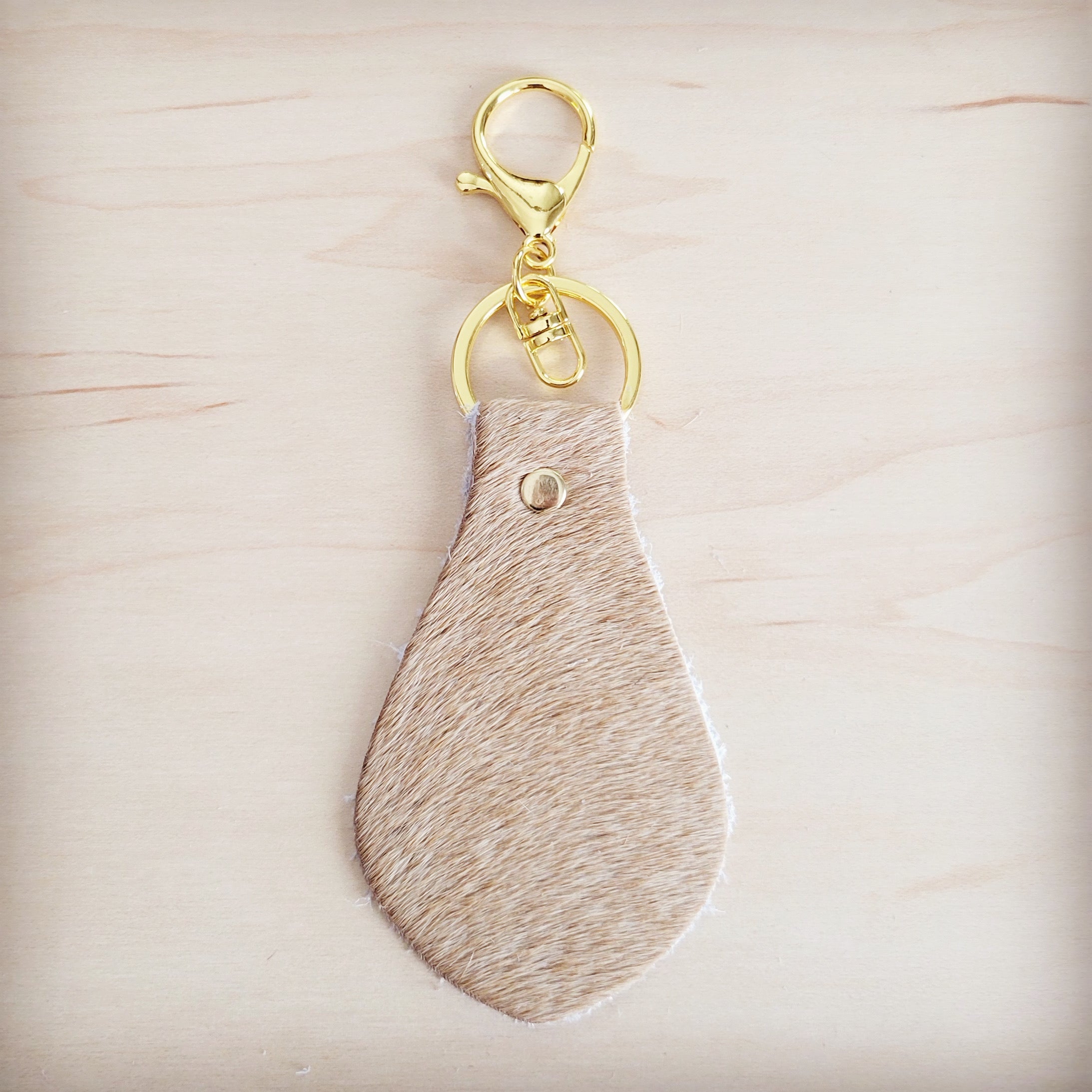 Close view of the light tan hair on the leather key chain