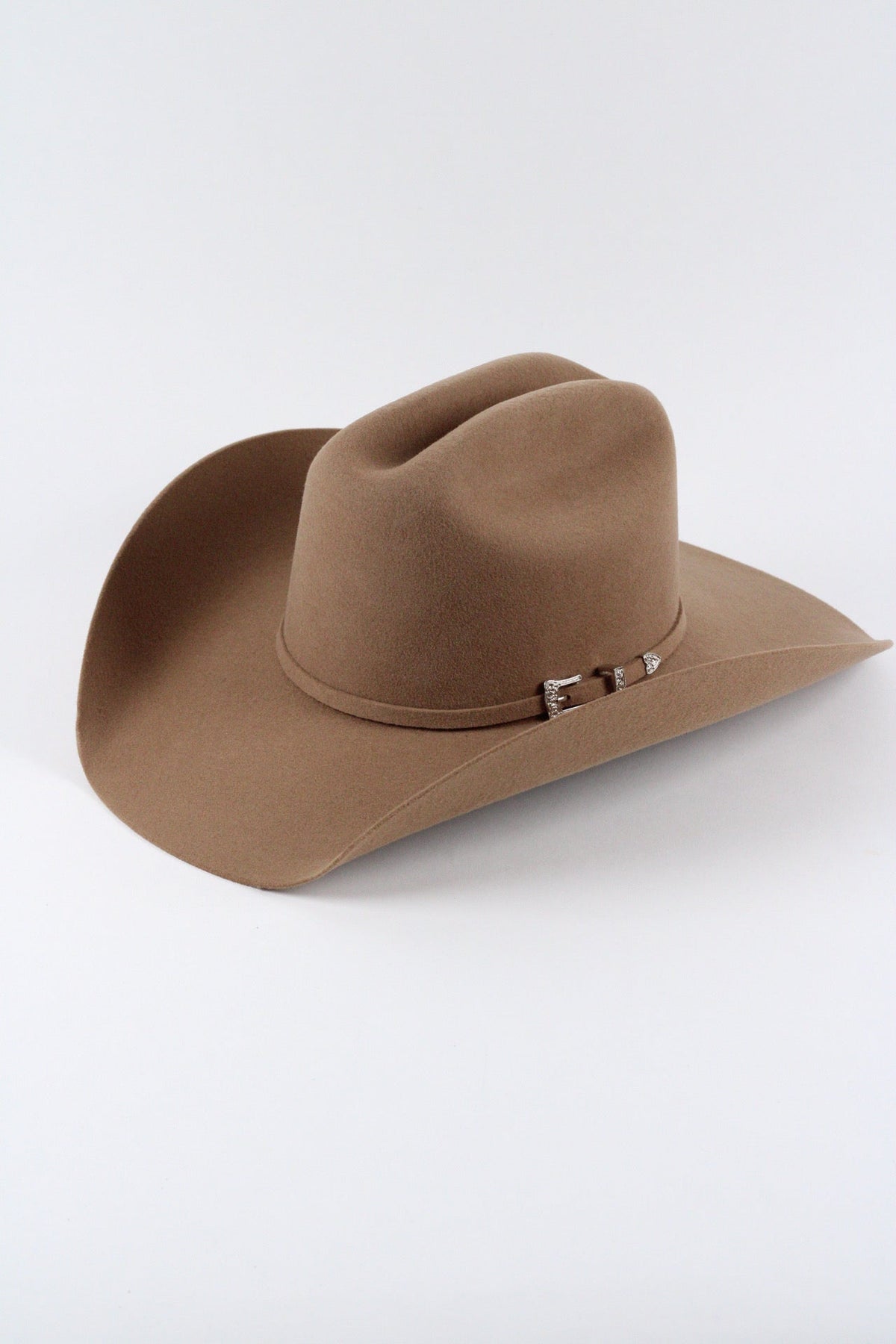 Camel Wren merino wool cowboy hat with a cattleman crown, three quarter view on a white background