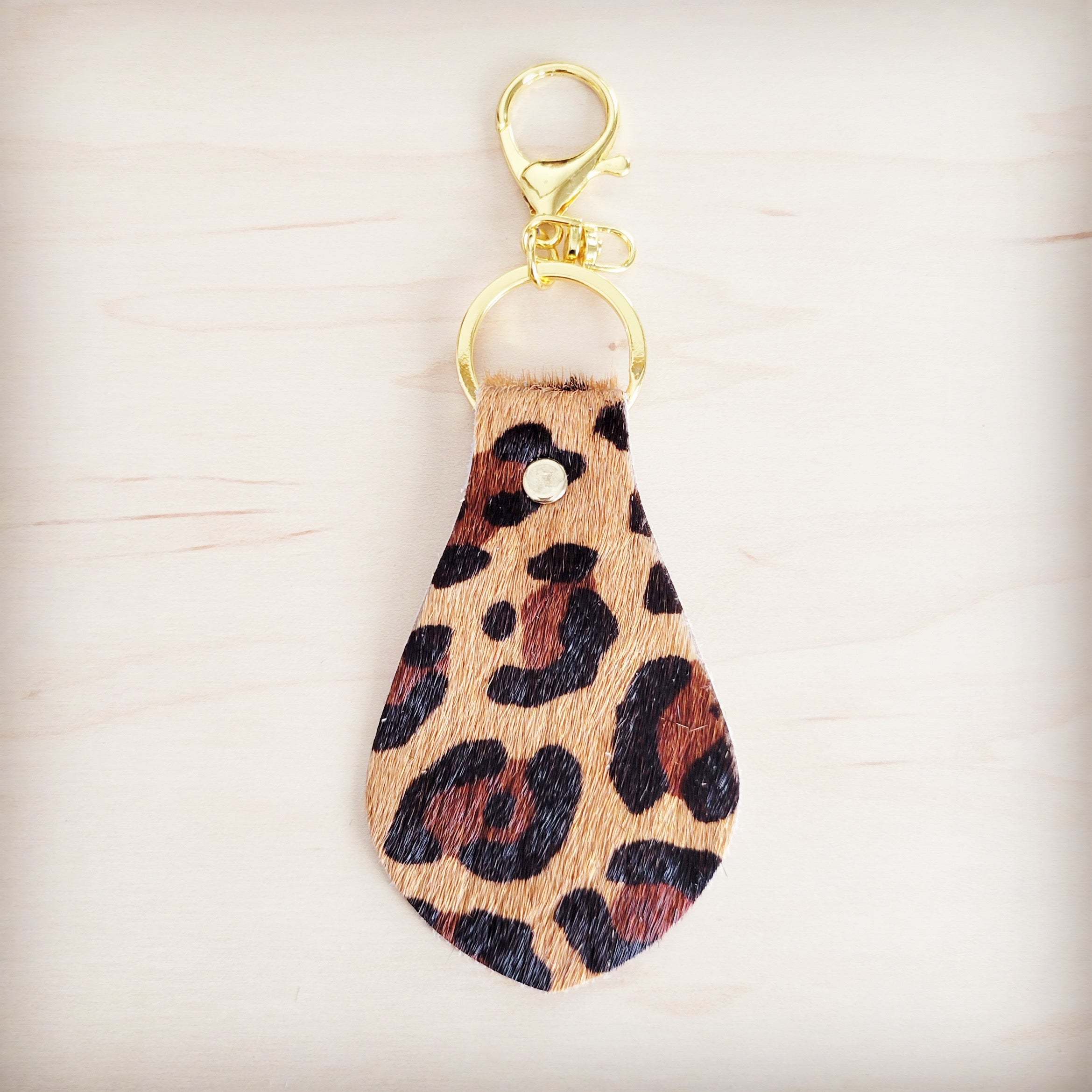 Leopard print hair-on-hide leather key chain with gold hardware