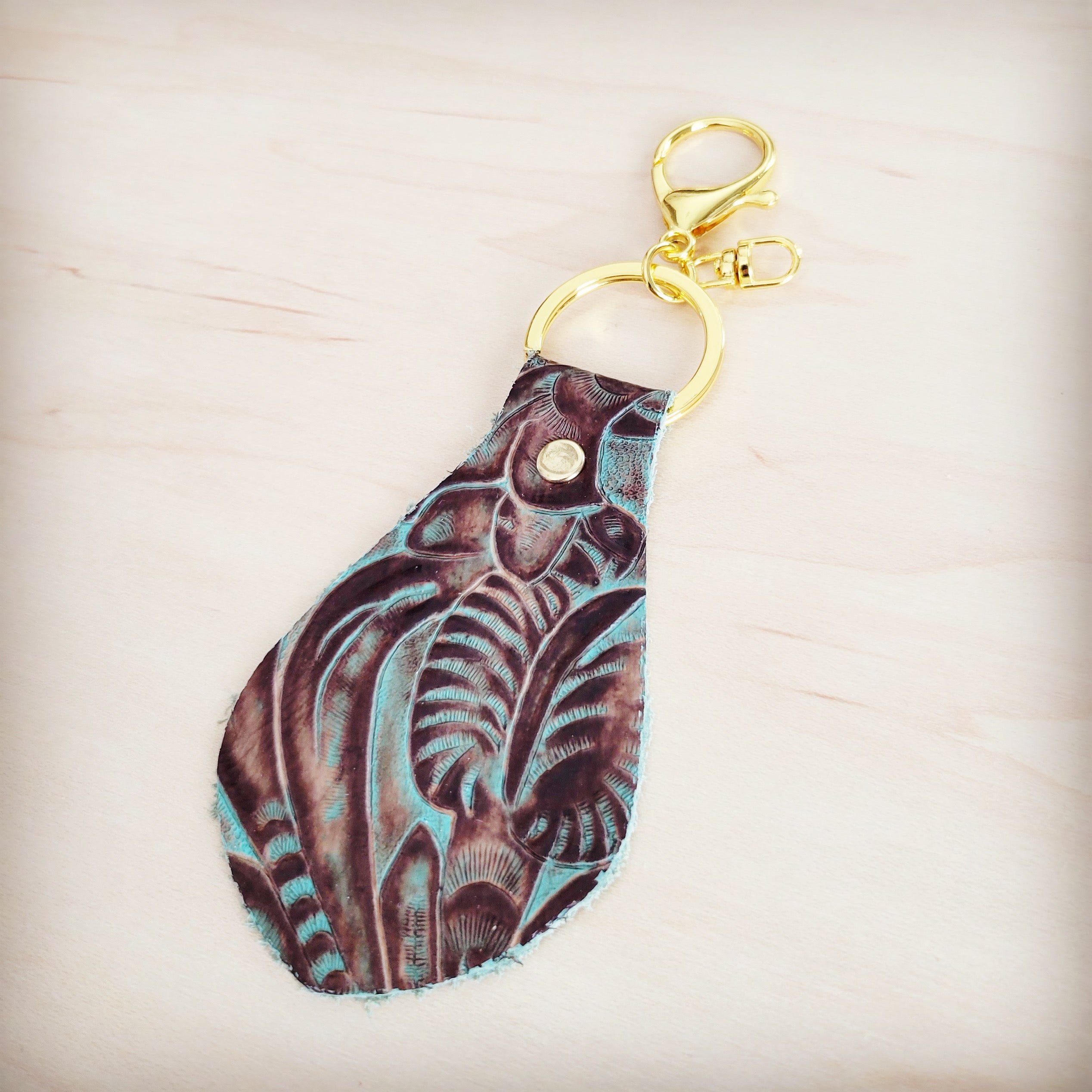 Back of the floral tooled leather key chain showing the leather backing