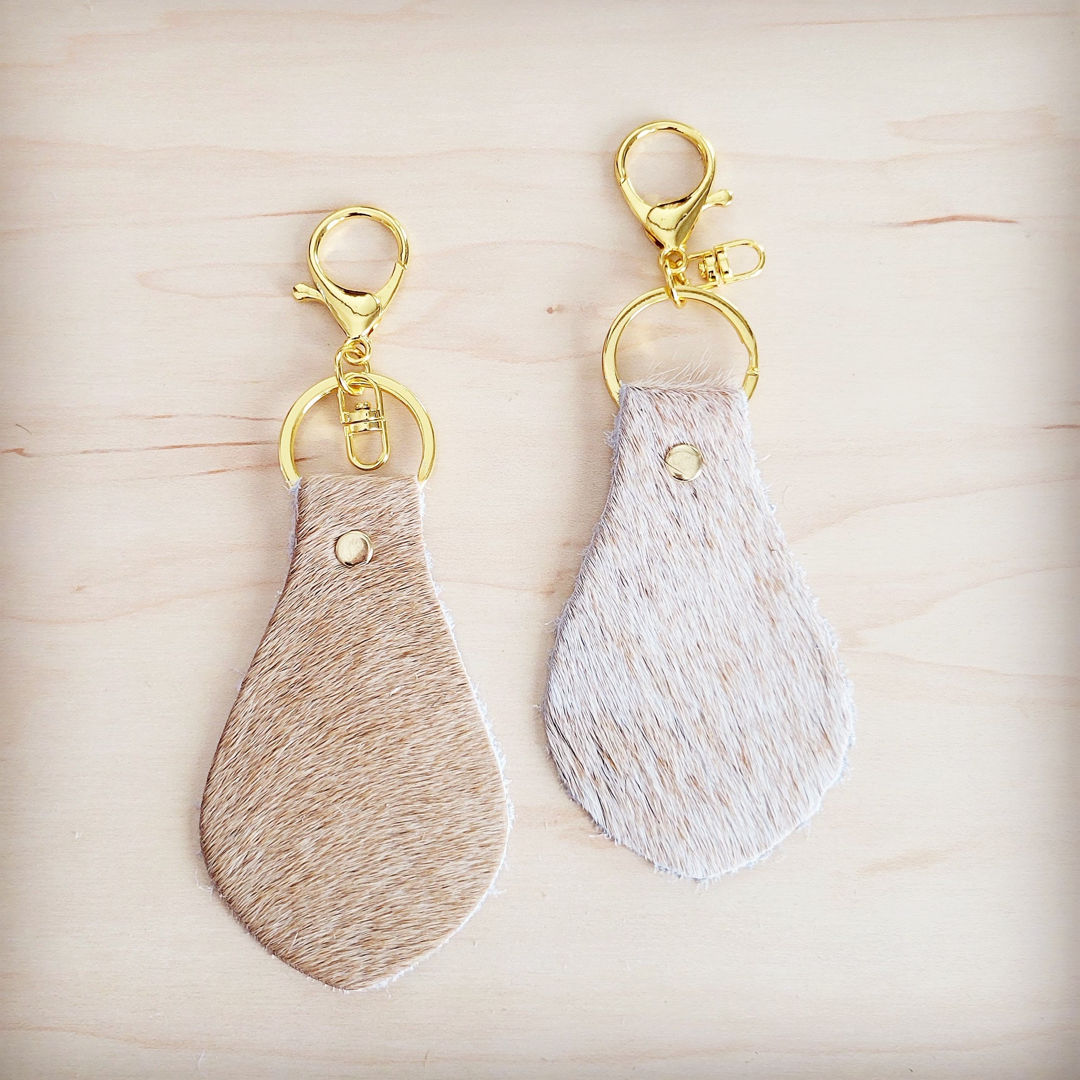 Light tan hair-on-hide leather key chain with gold hardware