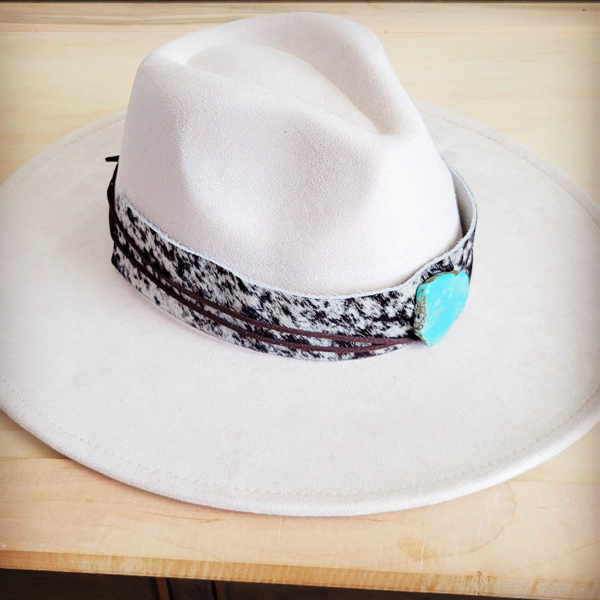 Black and white speckled hair-on-hide hat band with a turquoise-look slab, additional view