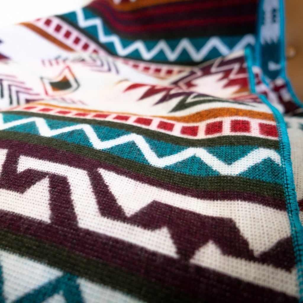 Turquoise, red and cream geometric alpaca blanket, view 3
