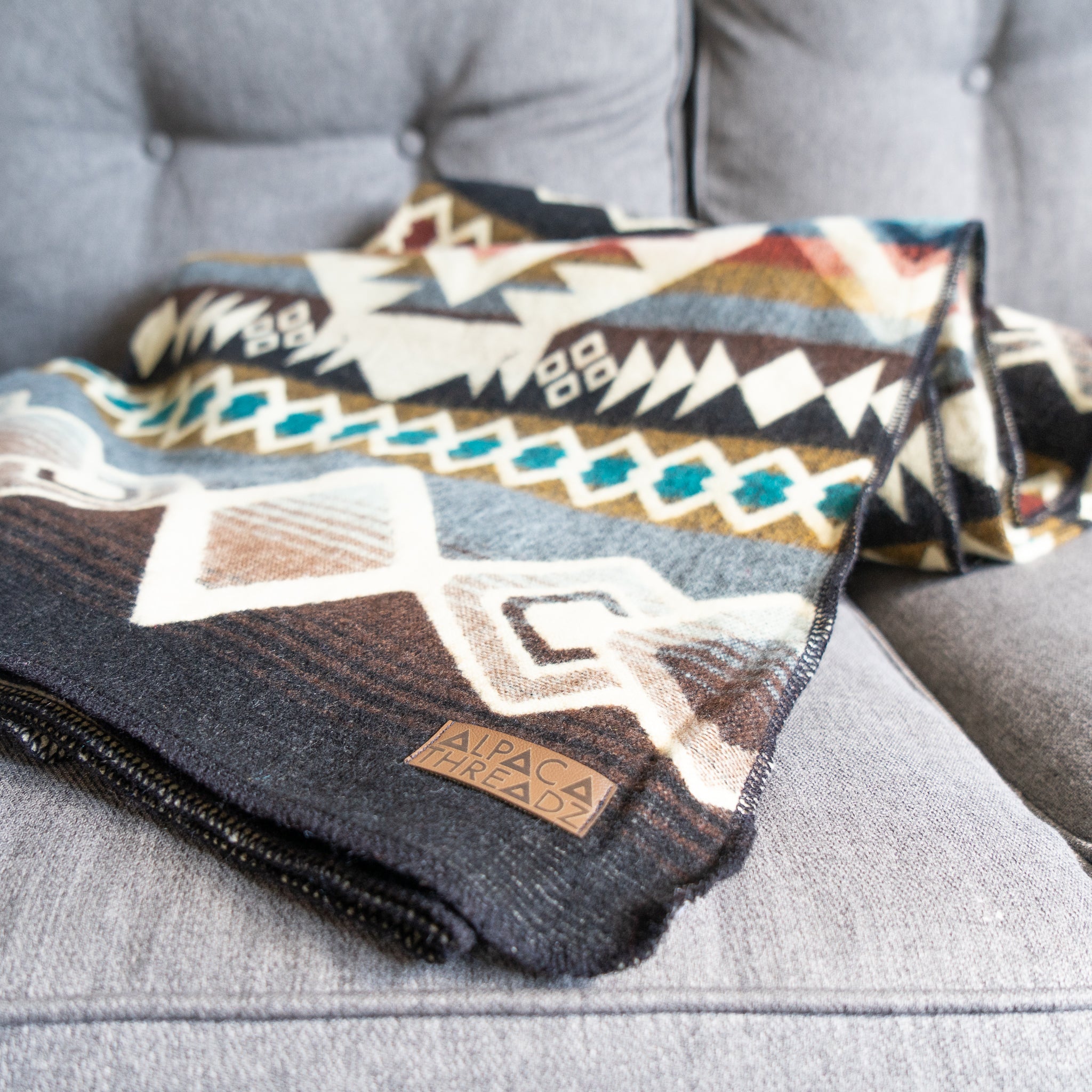 Camel, cream and turquoise geometric alpaca blanket, view 5