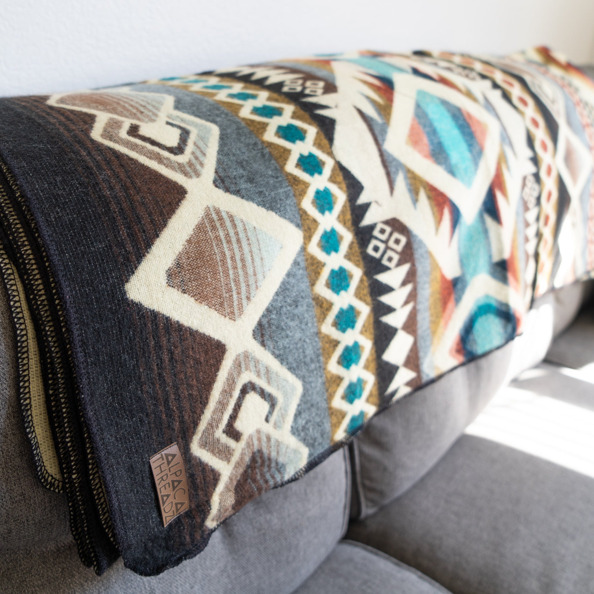 Camel, cream and turquoise geometric alpaca blanket, view 4