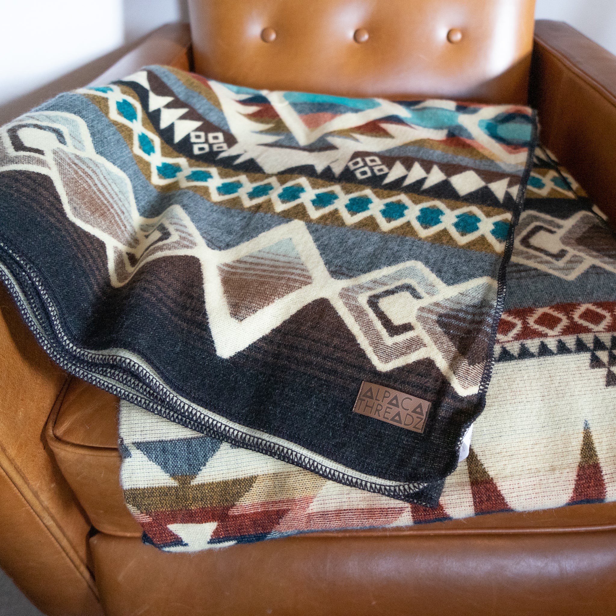Camel, cream and turquoise geometric alpaca blanket, view 9
