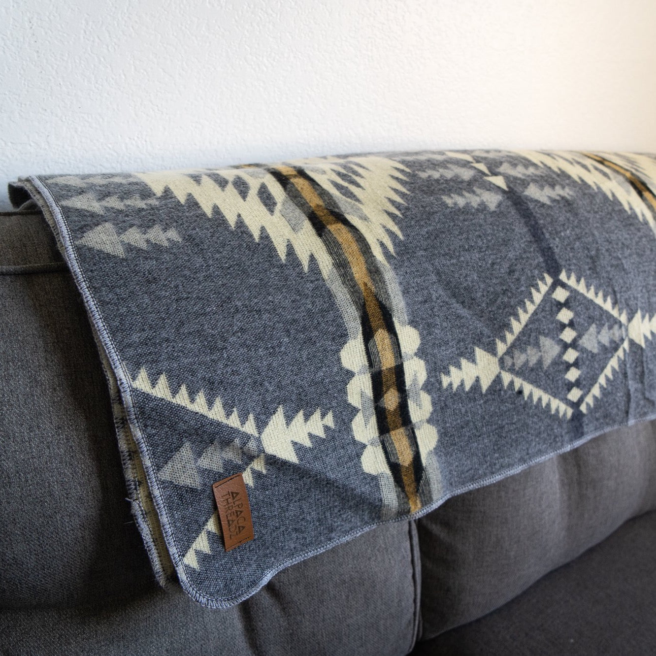 Soft grey and cream arrow and diamond alpaca blanket