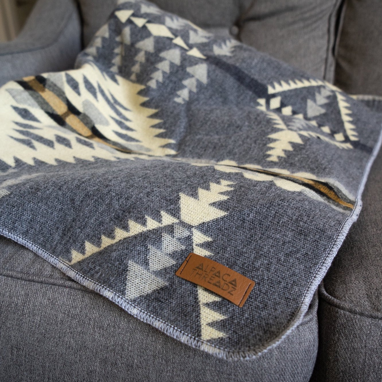 Soft grey and cream arrow and diamond alpaca blanket, view 6