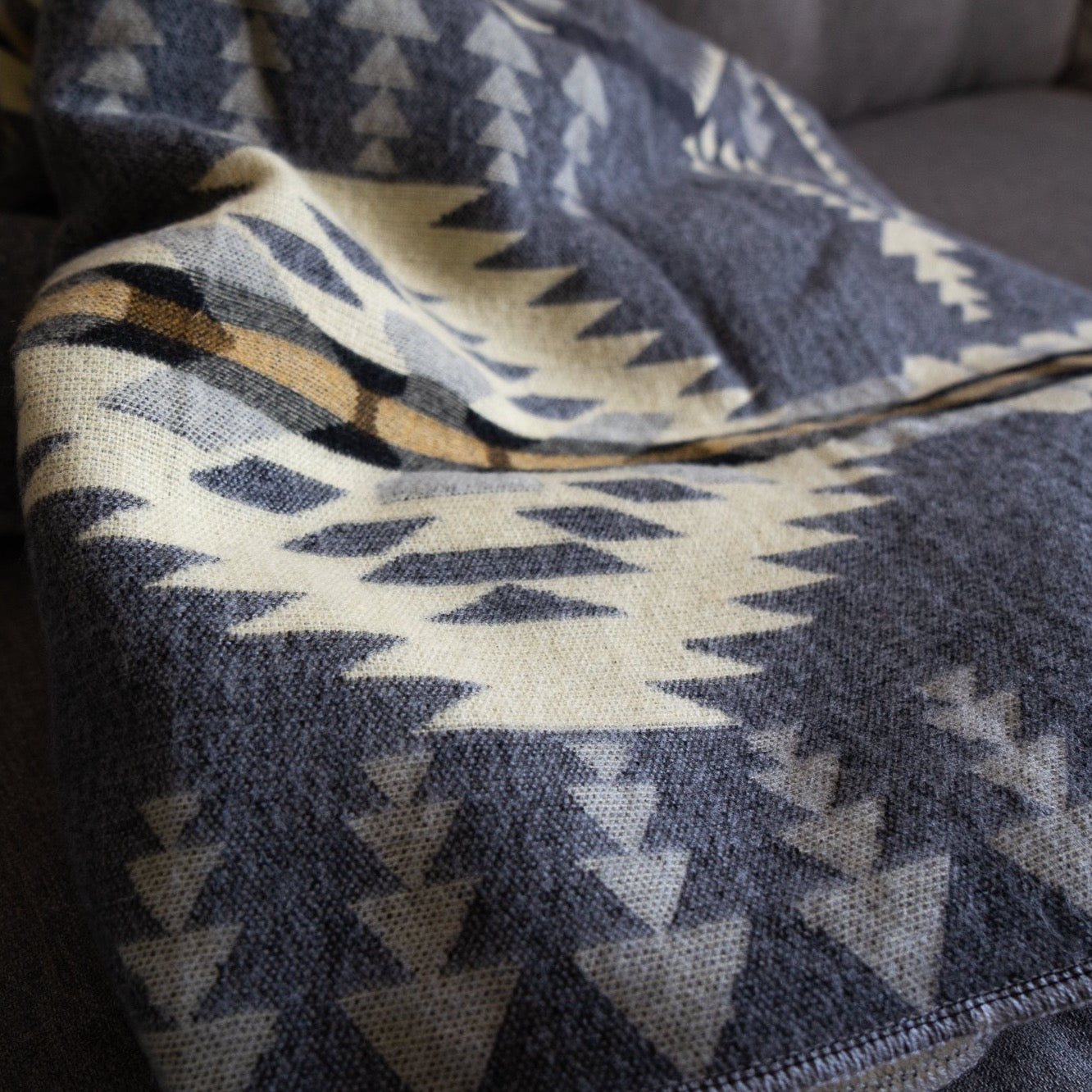Soft grey and cream arrow and diamond alpaca blanket, view 7