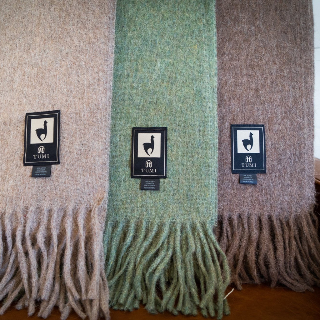 Solid color Peruvian alpaca fringe throw