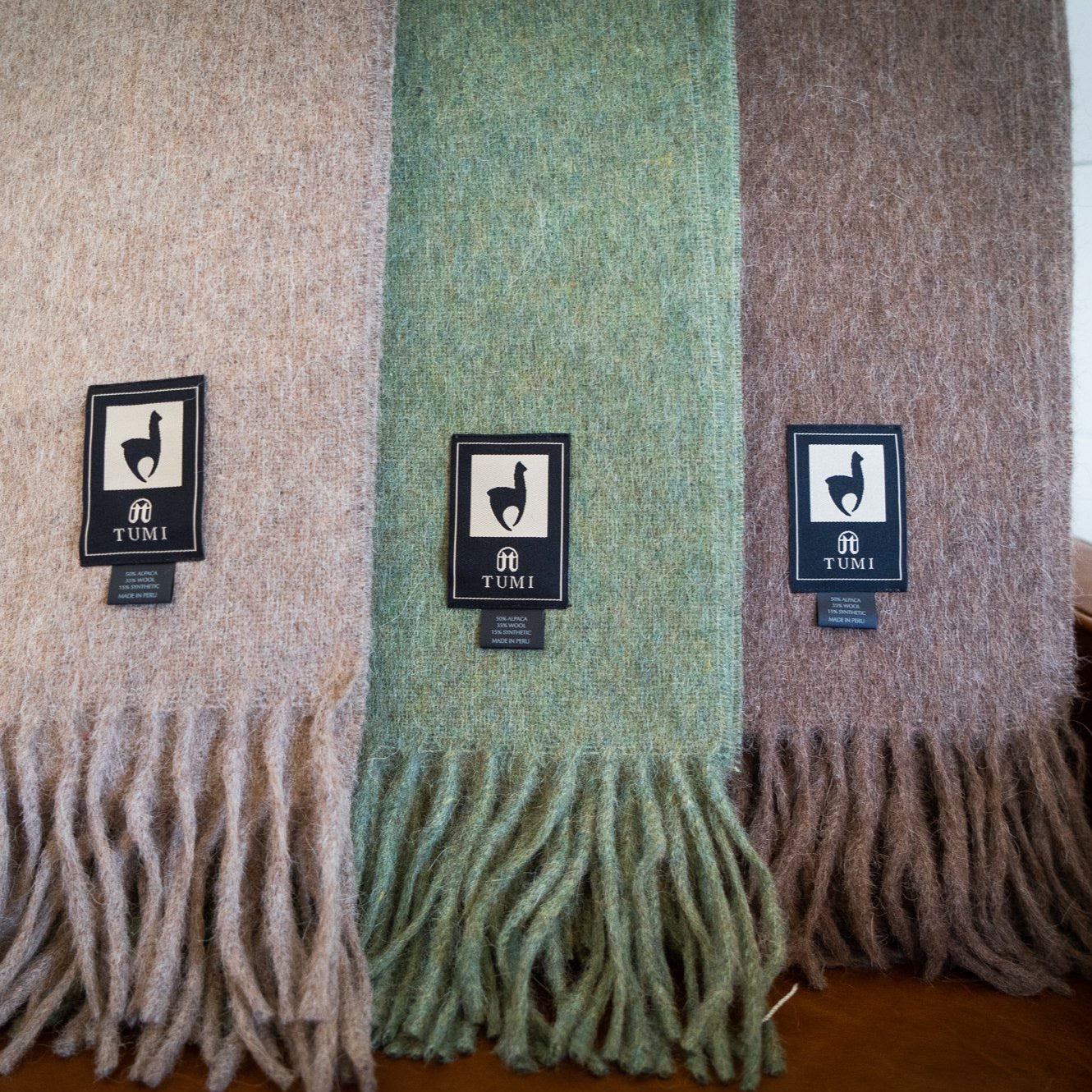 Solid color Peruvian alpaca fringe throw