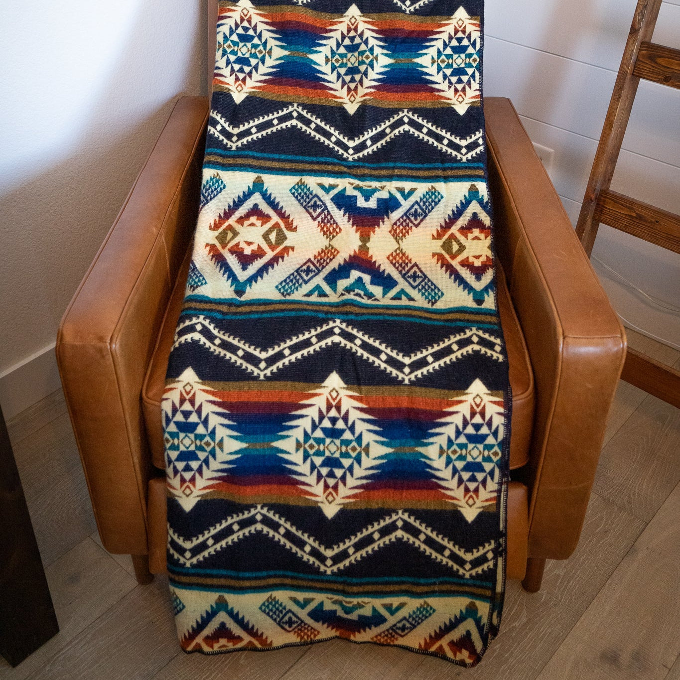 Navy, teal, rust and gold layered geometric alpaca blanket, view 9