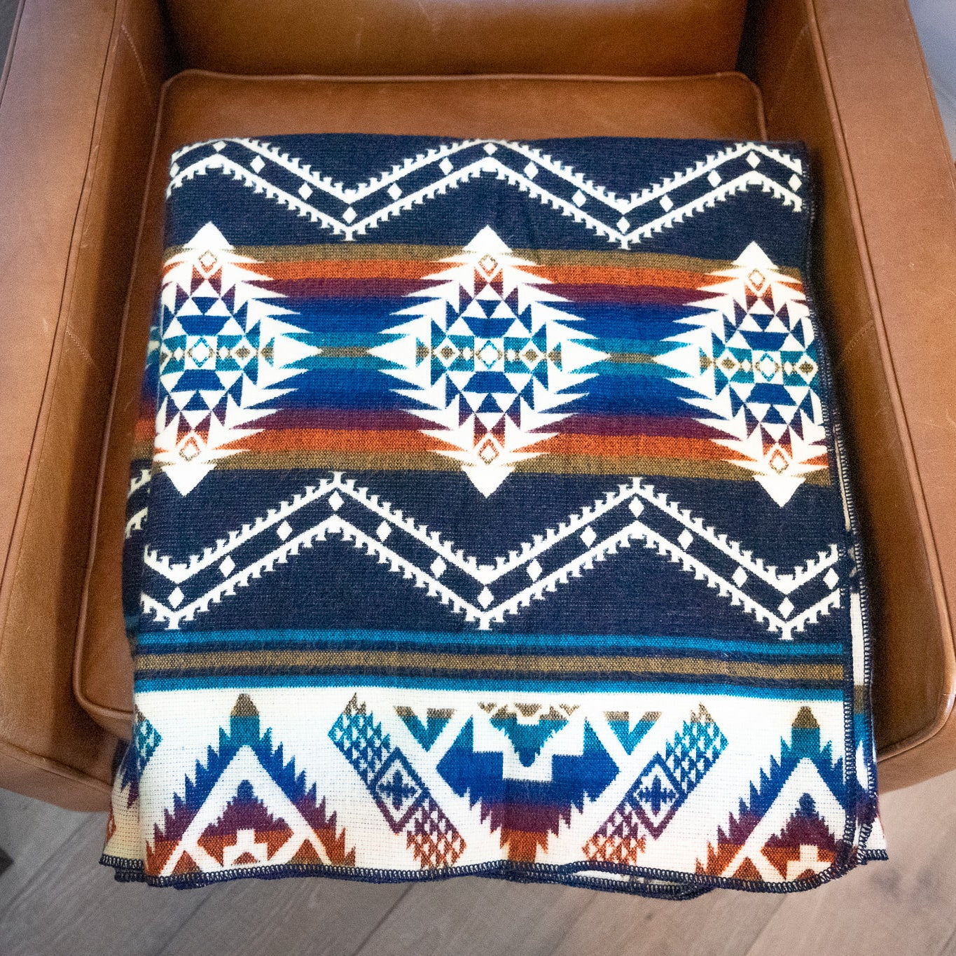 Navy, teal, rust and gold layered geometric alpaca blanket, view 11