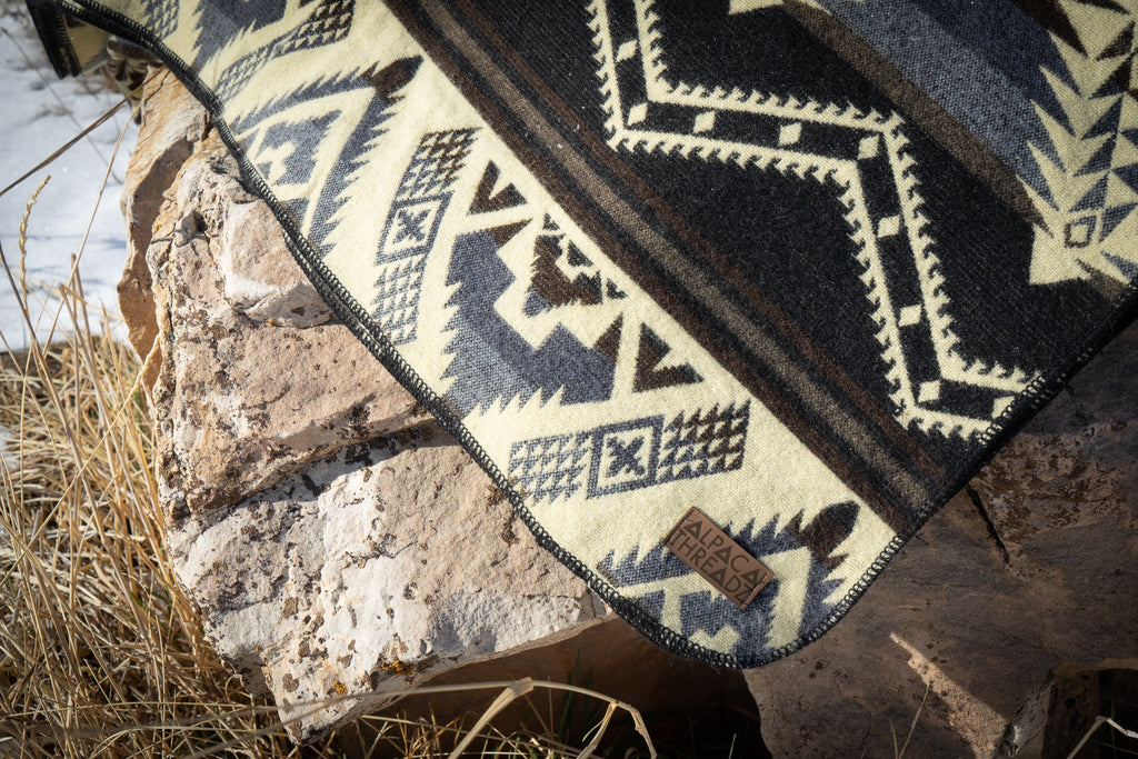 Black and cream monochrome geometric alpaca blanket, view 9