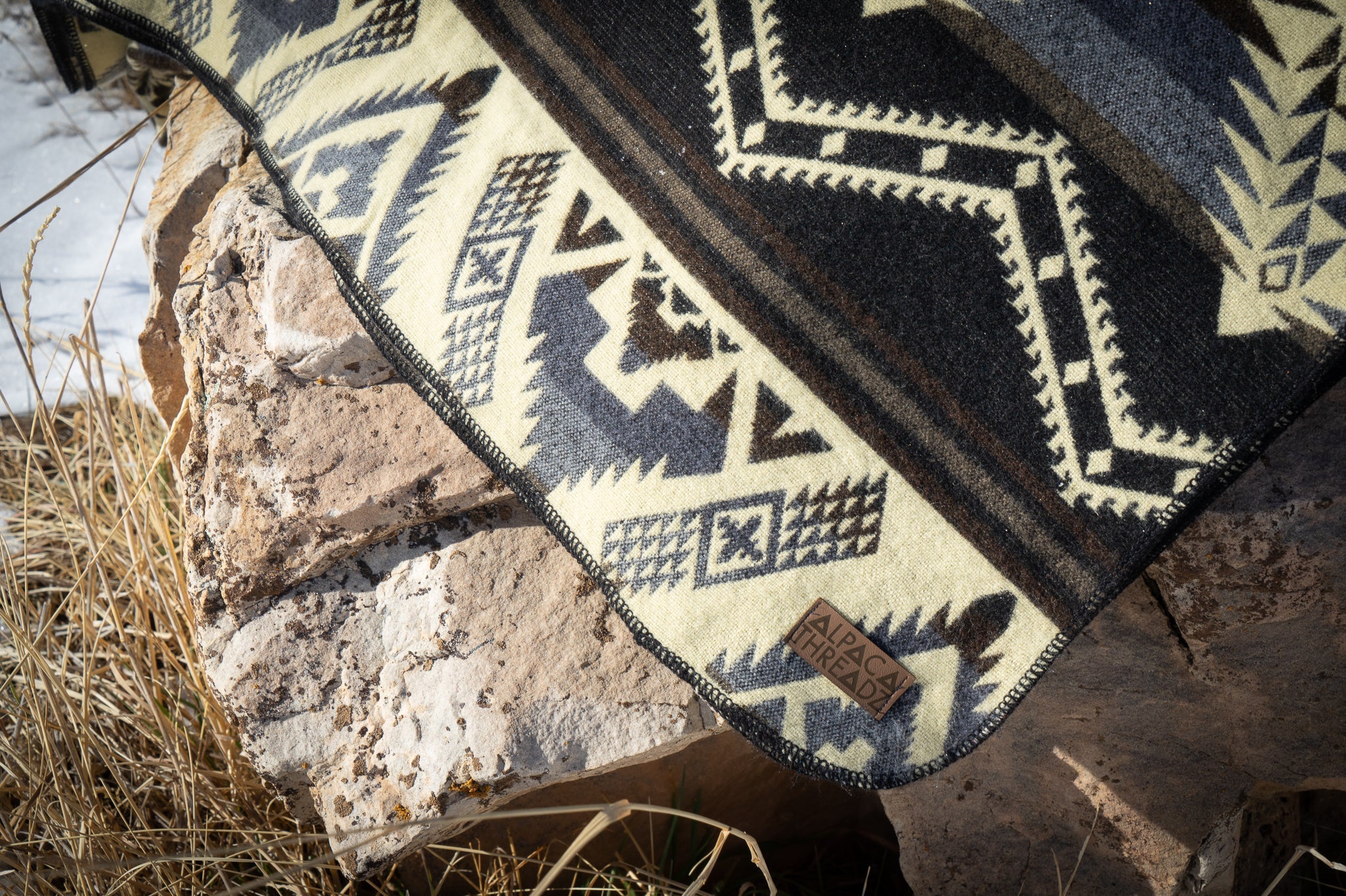 Black and cream monochrome geometric alpaca blanket, view 9