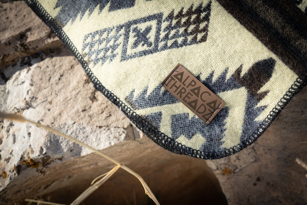 Black and cream monochrome geometric alpaca blanket, view 10