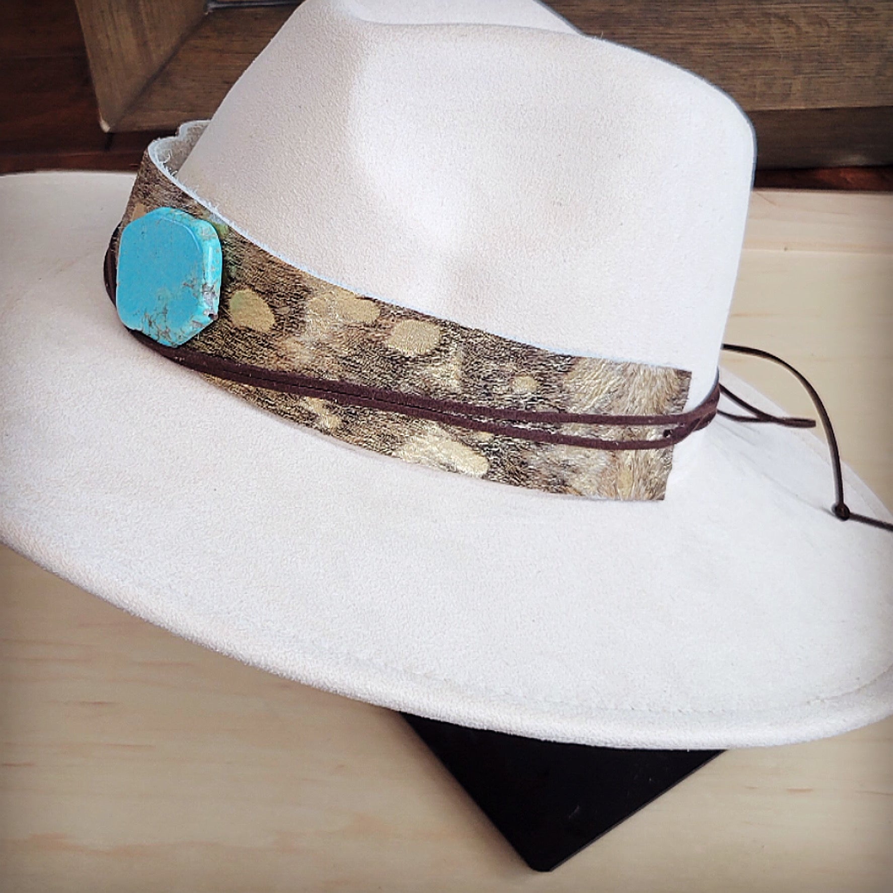 Gold metallic hair-on-hide hat band with a turquoise-look slab, additional view