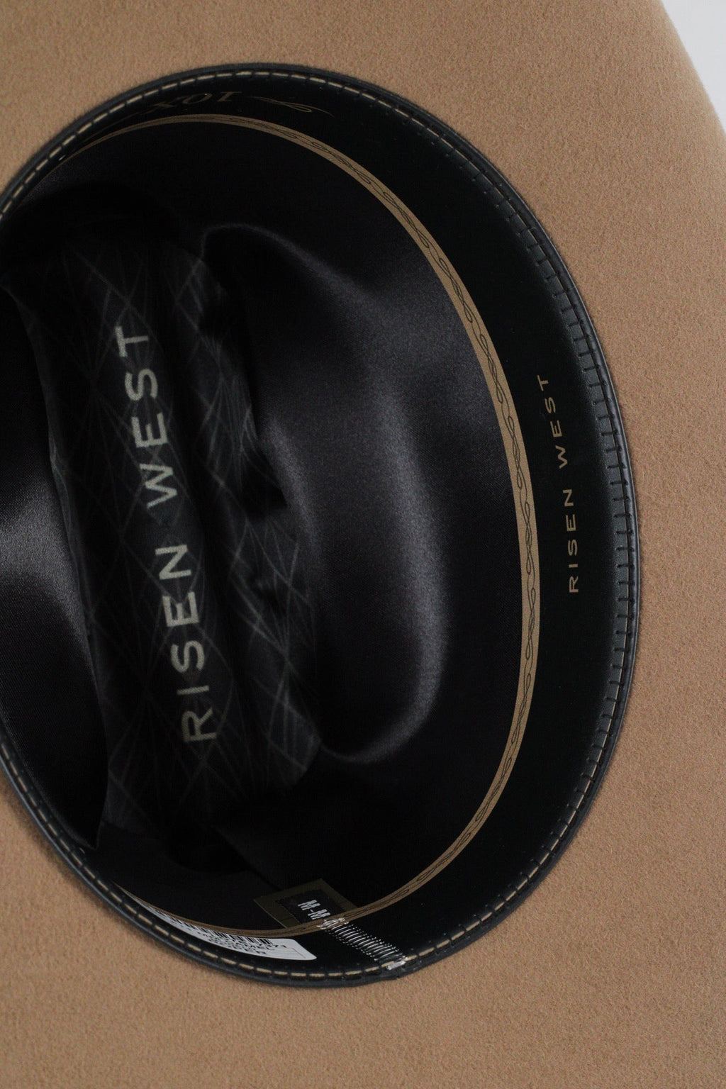 Close view inside the camel Wren cowboy hat showing the black satin lining and sweatband