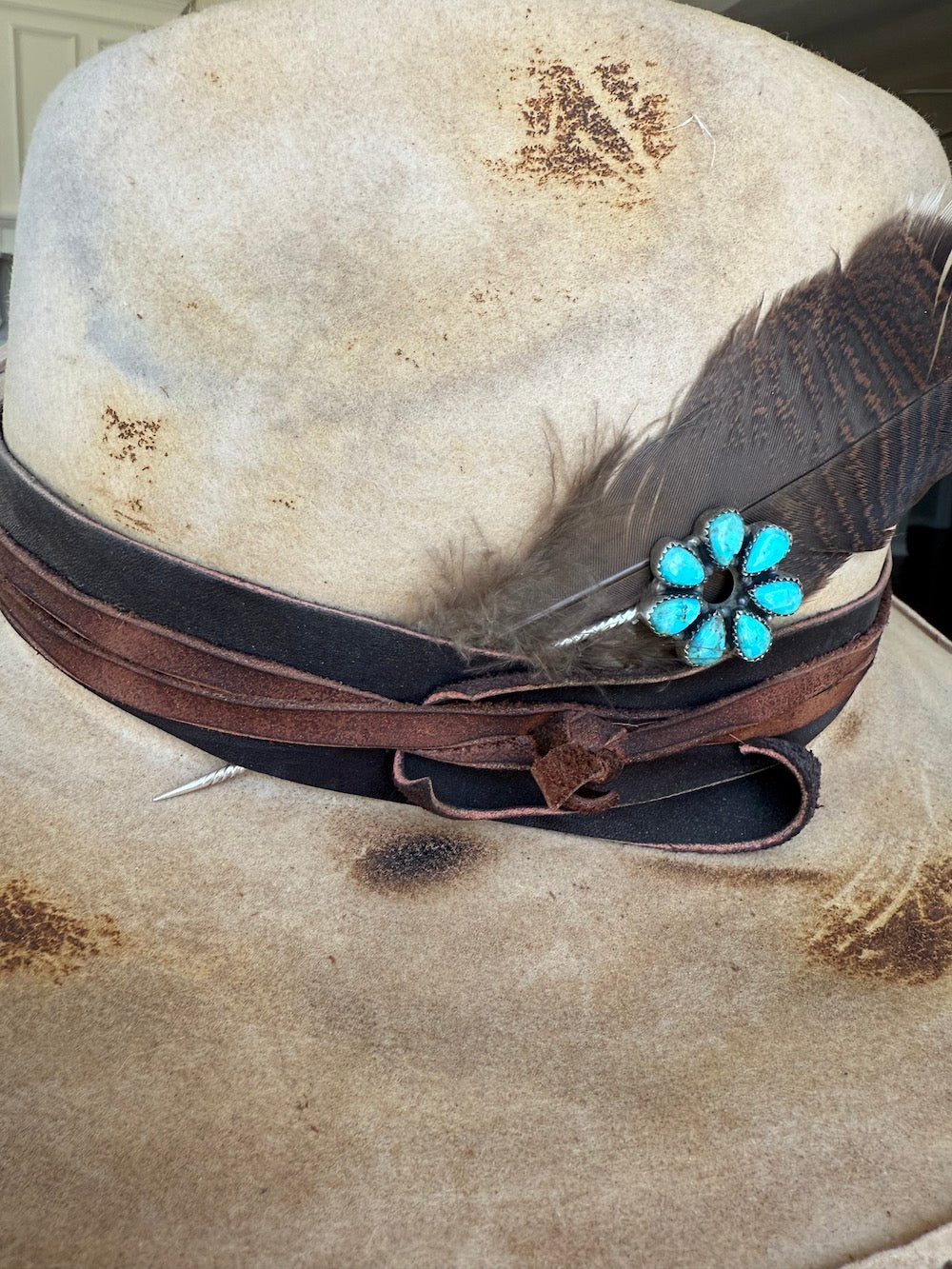 Close view of the seven Kingman turquoise stones in the sterling silver hat pin cluster