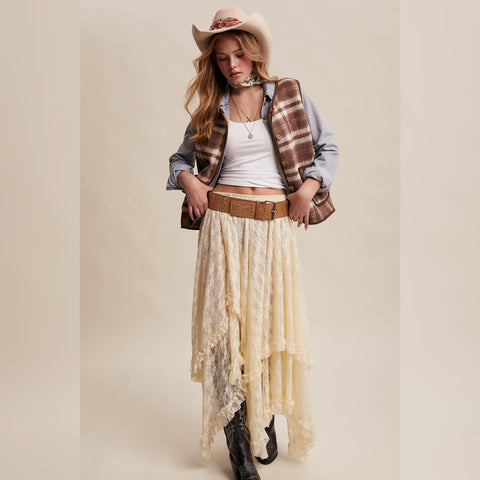 Brown plaid vest with sherpa lining, worn over a chambray shirt