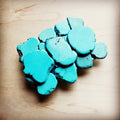 Large turquoise slab belt buckle on a silver-tone frame