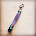 Turquoise and purple embossed leather wristlet key chain with a swivel clip