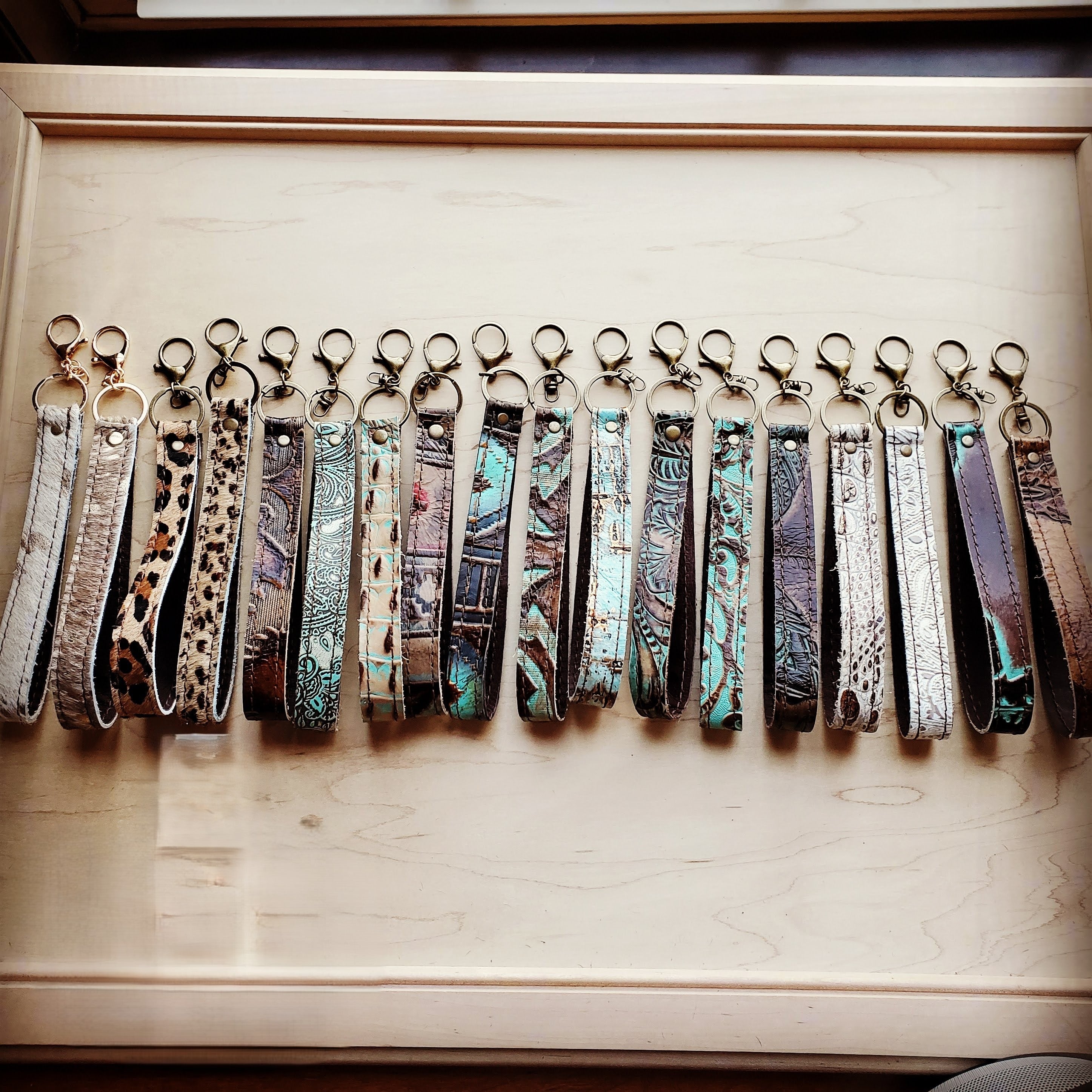 Close view of the turquoise and purple wash on the tooled leather wristlet