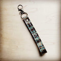 Turquoise and black embossed leather wristlet key chain with a swivel clip