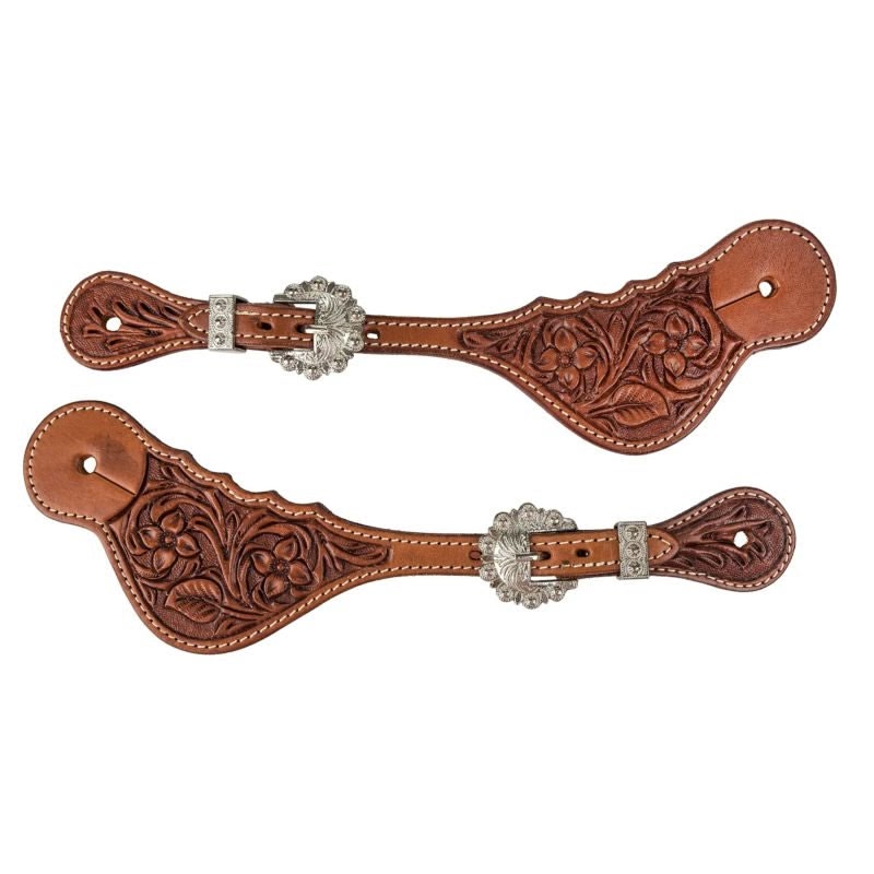 Pair of chestnut leather spur straps tooled edge to edge with flowers and leaves, a round engraved concho over each buckle and a stitched dot border