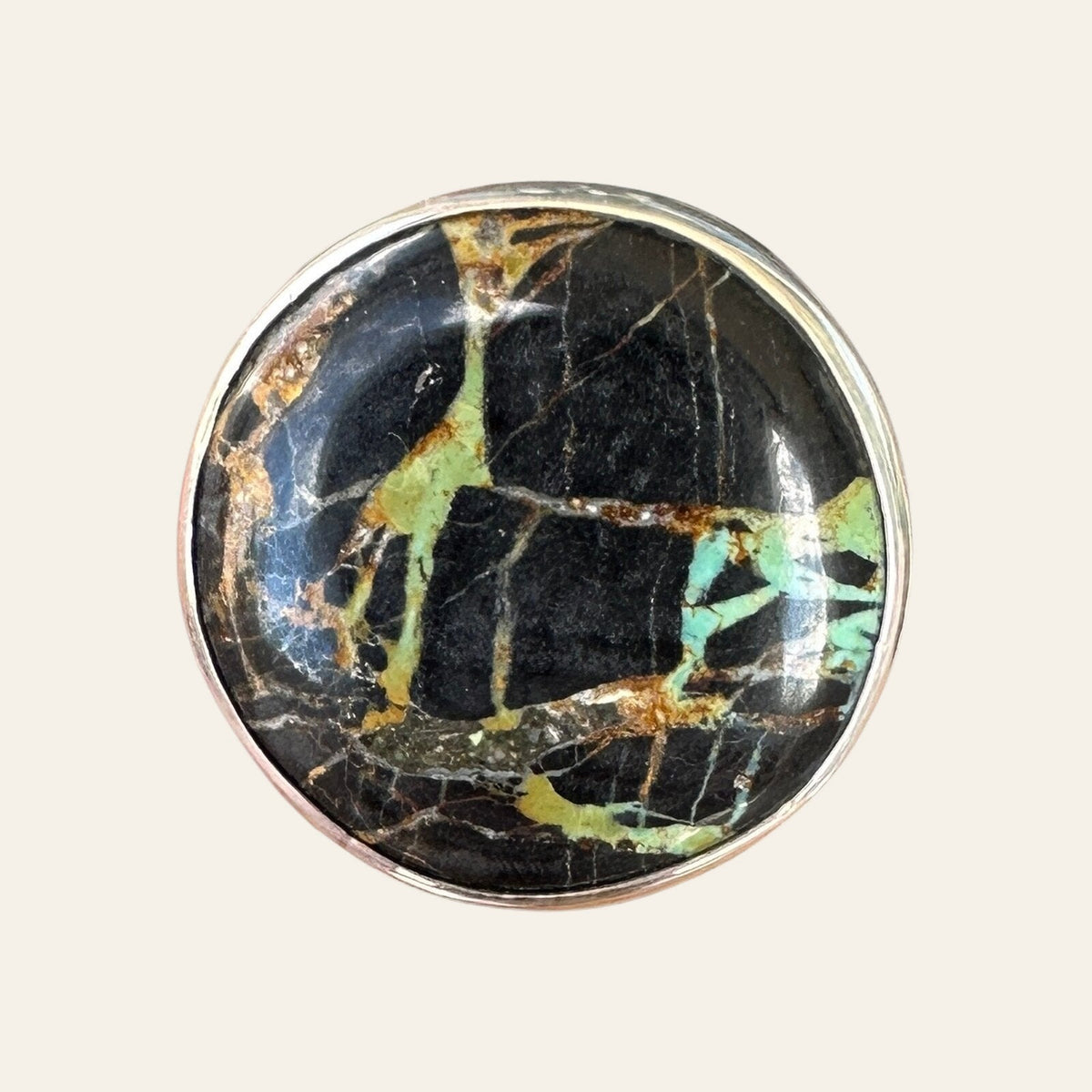 Black Jack Turquoise Ring in Sterling Silver, Size 8.25, shown on a cream background