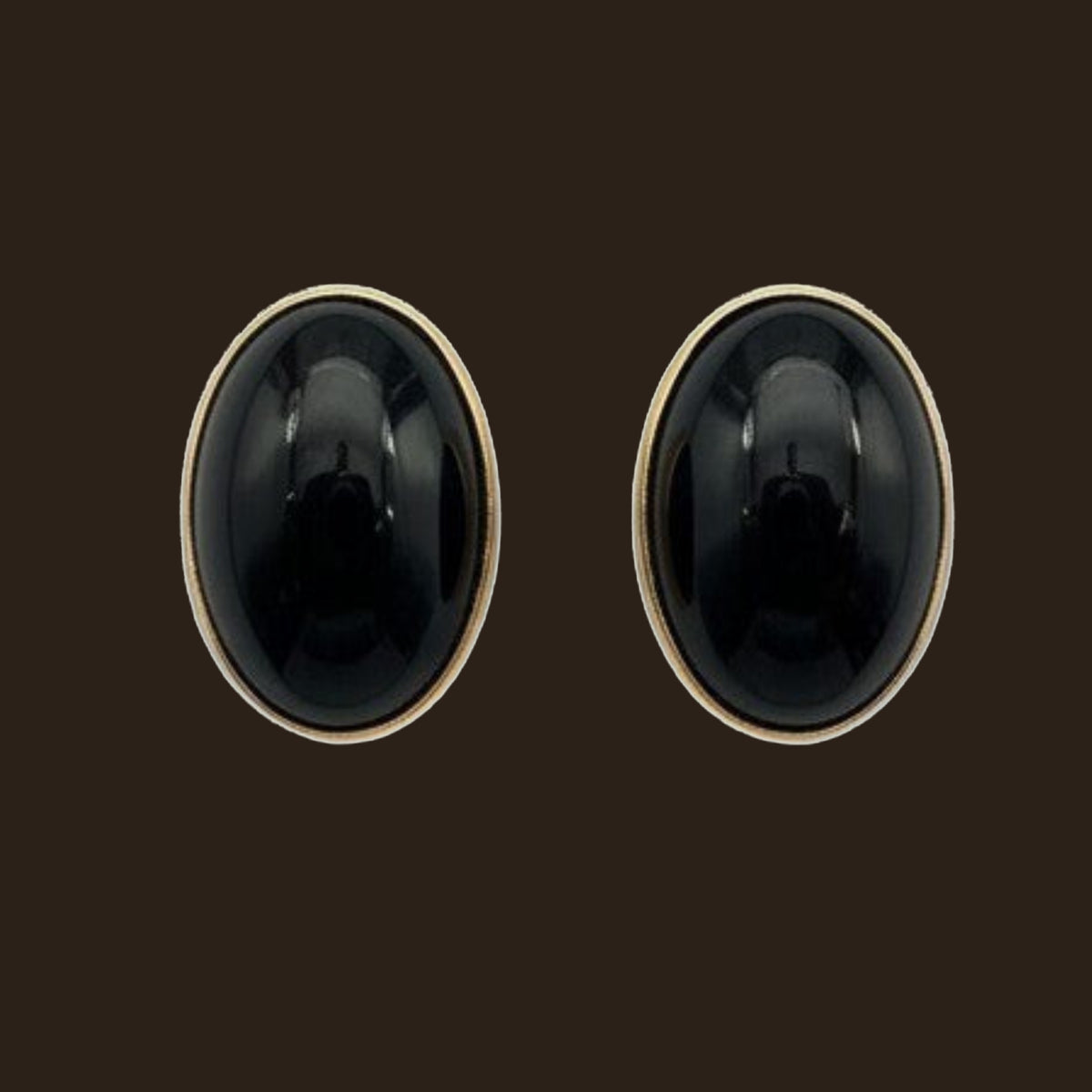 Black Onyx Oval Stud Earrings in Solid 14K Gold, shown on an espresso background