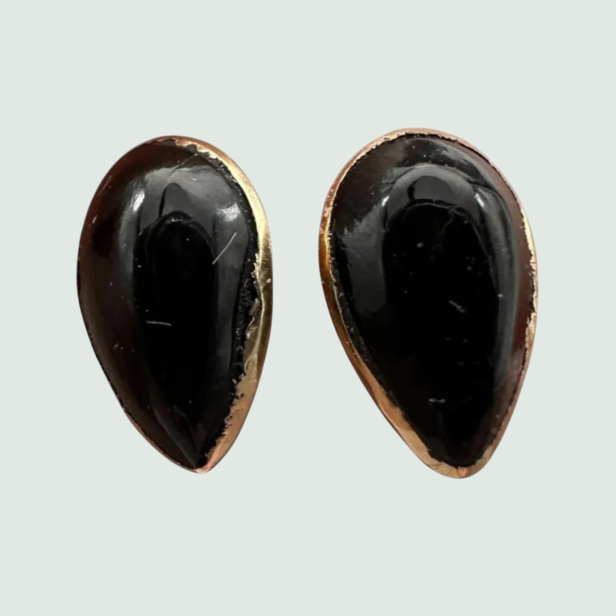Black Onyx Teardrop Stud Earrings in Solid 14K Gold, shown on a sage mist background