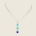 Turquoise, opal and lapis necklace in sterling silver by Rick Tolino, shown on a bone linen background